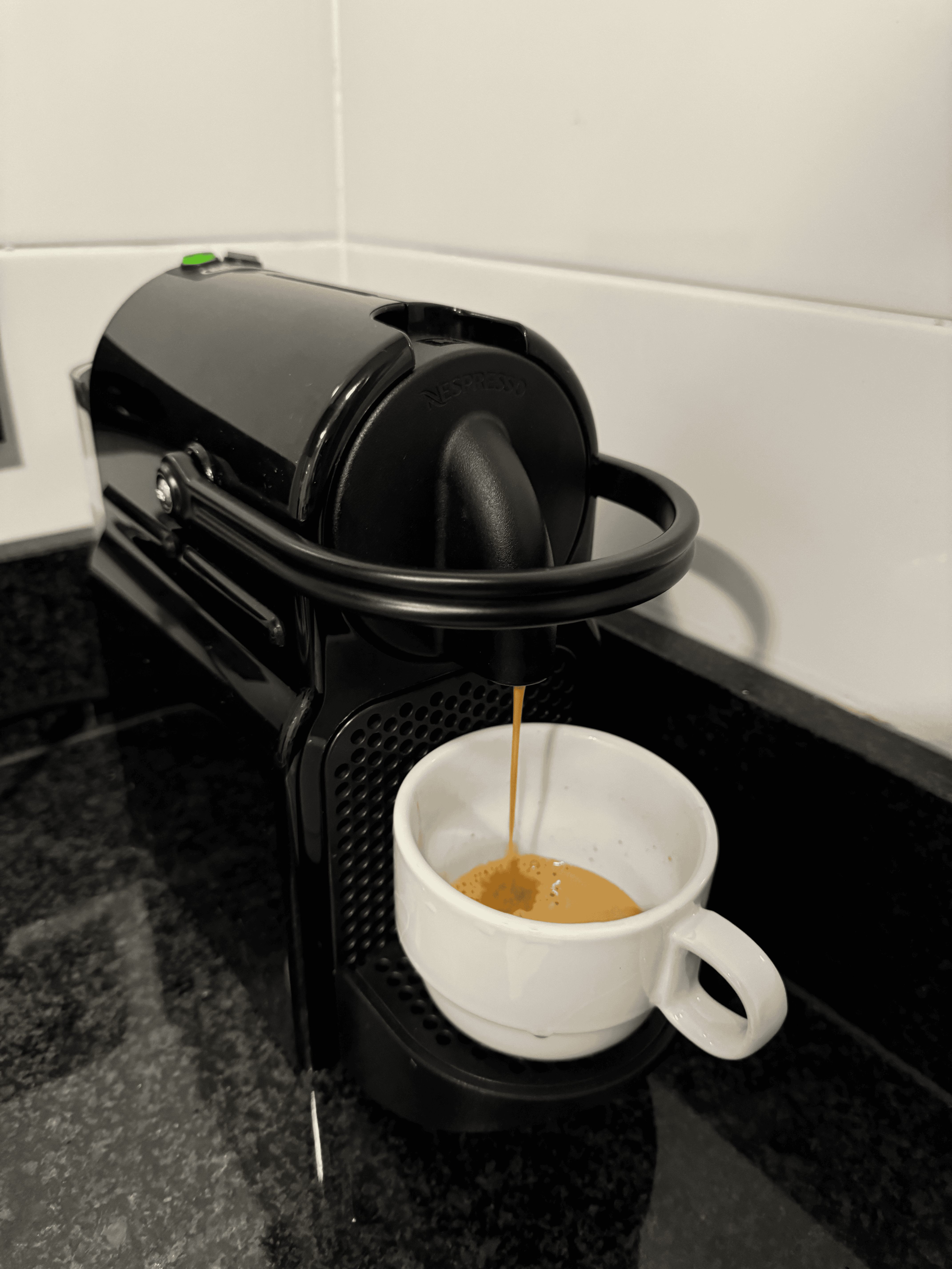 A Nespresso OriginalLine brewing coffee.